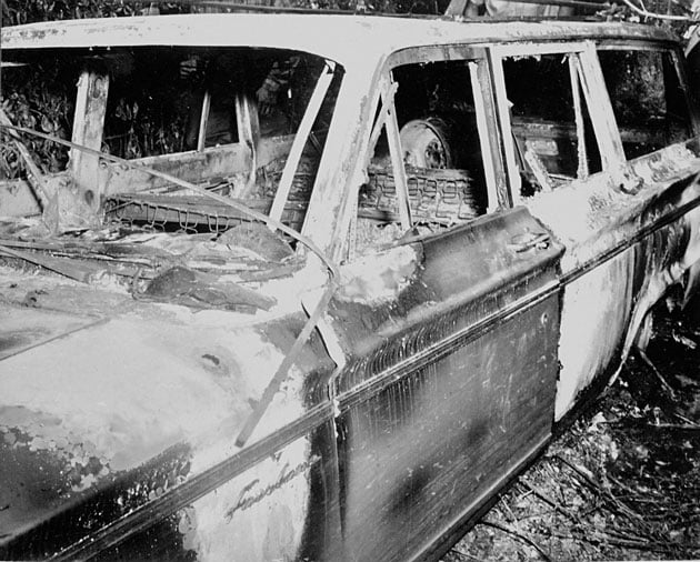 The Charred Shell of The Mississippi Three's Ford Station Wagon 1964