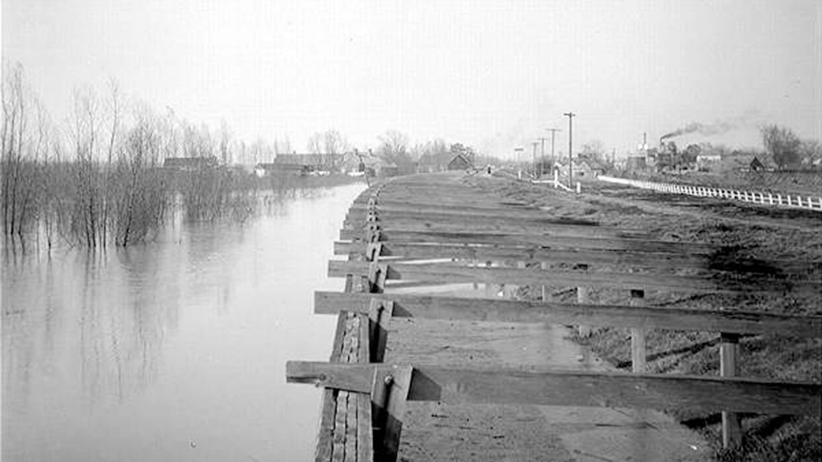 A high river and board revetment at Carrollton Bend in New Orleans, Louisiana, circa 1900