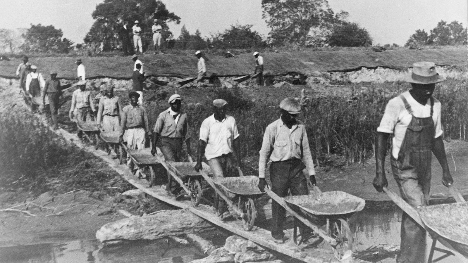 Workers build a levee in Plaquemine Parish, just south of New Orleans, Louisiana, in 1935