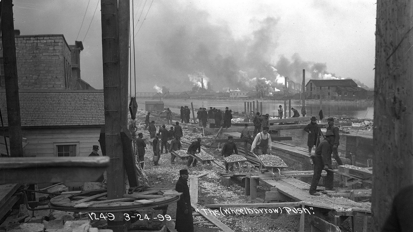 Workers move gravel during lock construction along the Chicago Sanitary and Ship Canal in Joliet, Illinois, on March 24, 1899