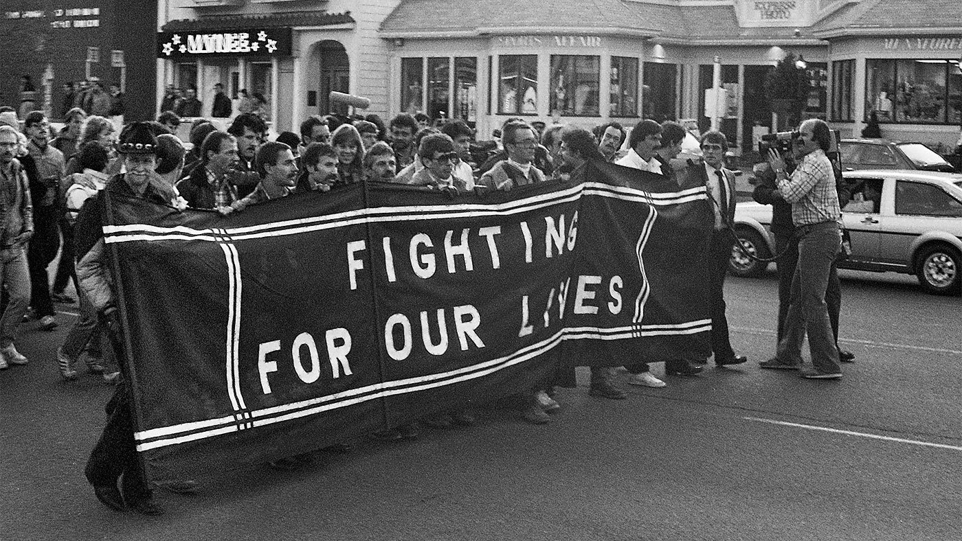 AIDS march with 'Fighting for Our Lives' banner