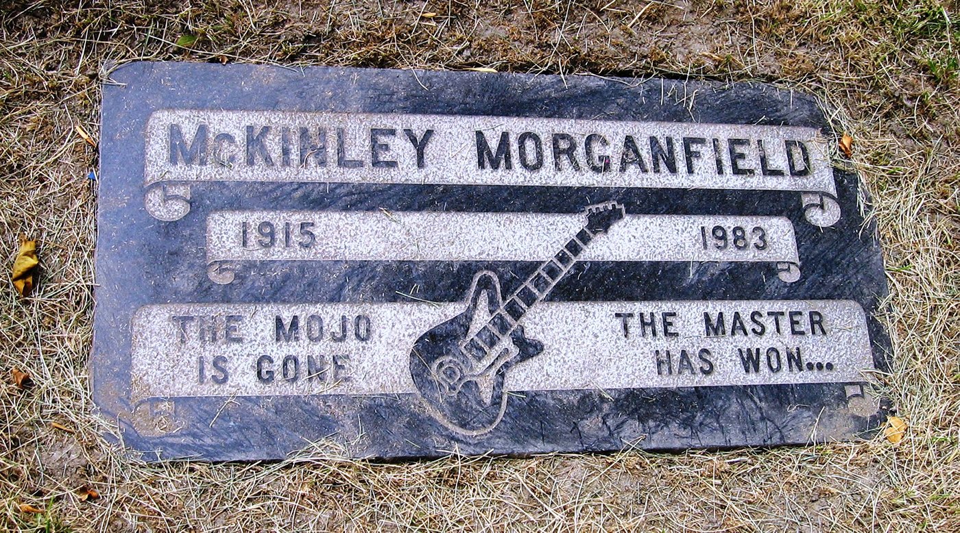 Muddy Waters' grave marker, with a guitar on it
