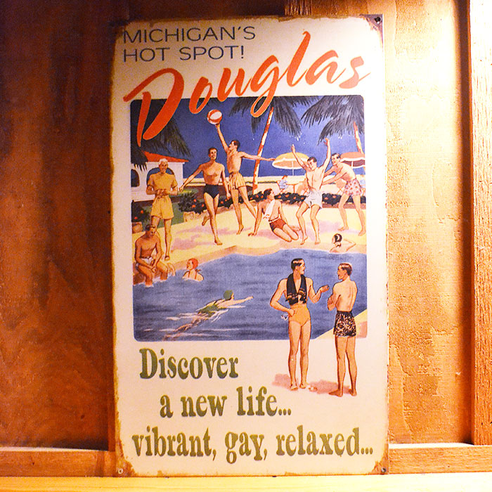 Vintage sign that says 'Discover a new life...vibrant, gay, relaxed'