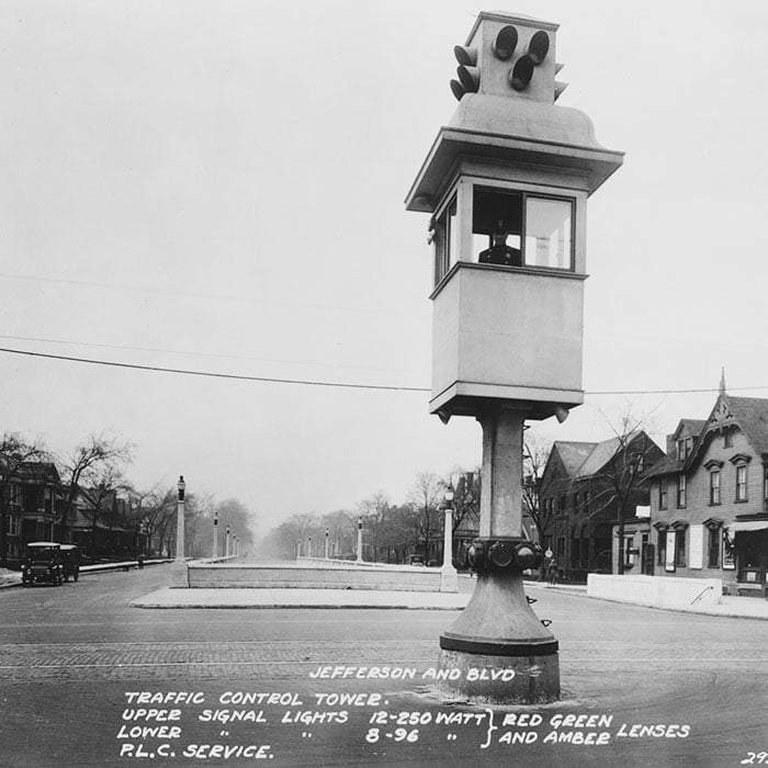 Policeman operating an early traffic light from a control tower at an intersection in Detroit, Michigan, circa 1922