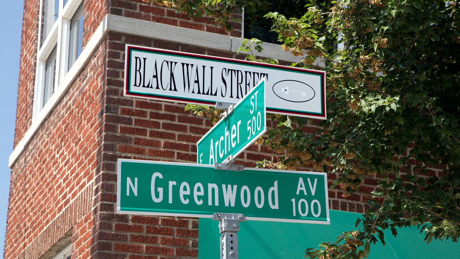 Street signs along Greenwood that commemorate Black Wall Street