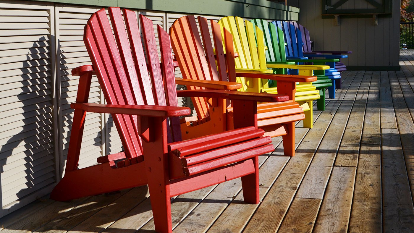 Colorful Adirondack chairs at the Dunes Resort