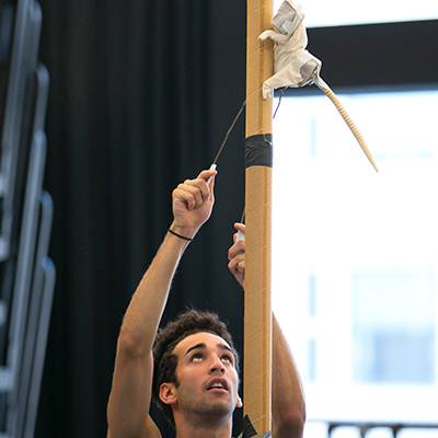 Edson Barbosa rehearsing with a mock-up rat puppet (Photo by Todd Rosenberg)