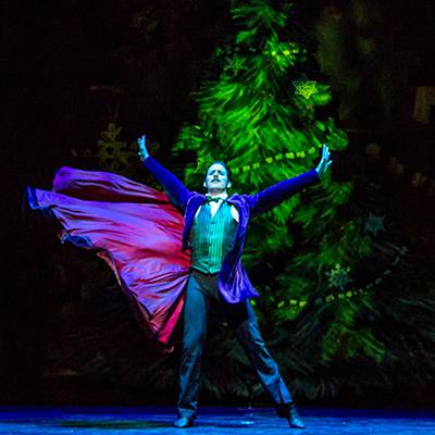 Miguel Blanco as the Great Impresario in front of the growing tree (Photo by Cheryl Mann)
