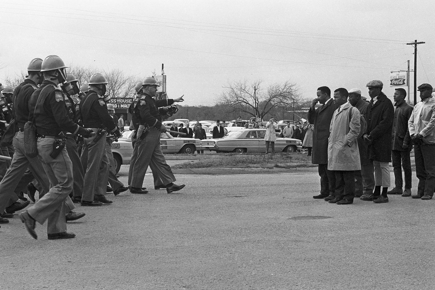 Hosea Williams and John Lewis confront troopers on Bloody Sunday, in Selma, Montgomery in 1965. Photo: Spider Martin