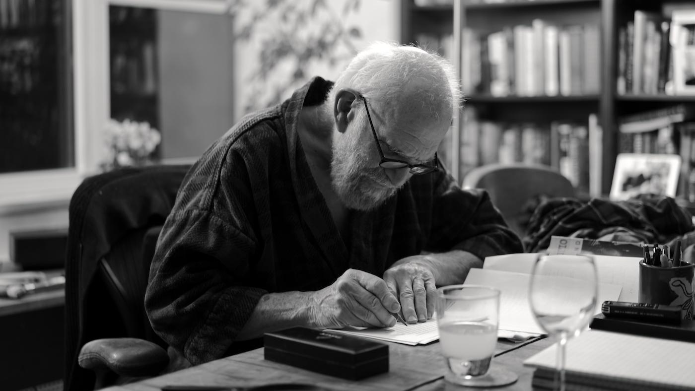 Oliver Sacks writing in a robe in his apartment, 2015. Photo: Bill Hayes