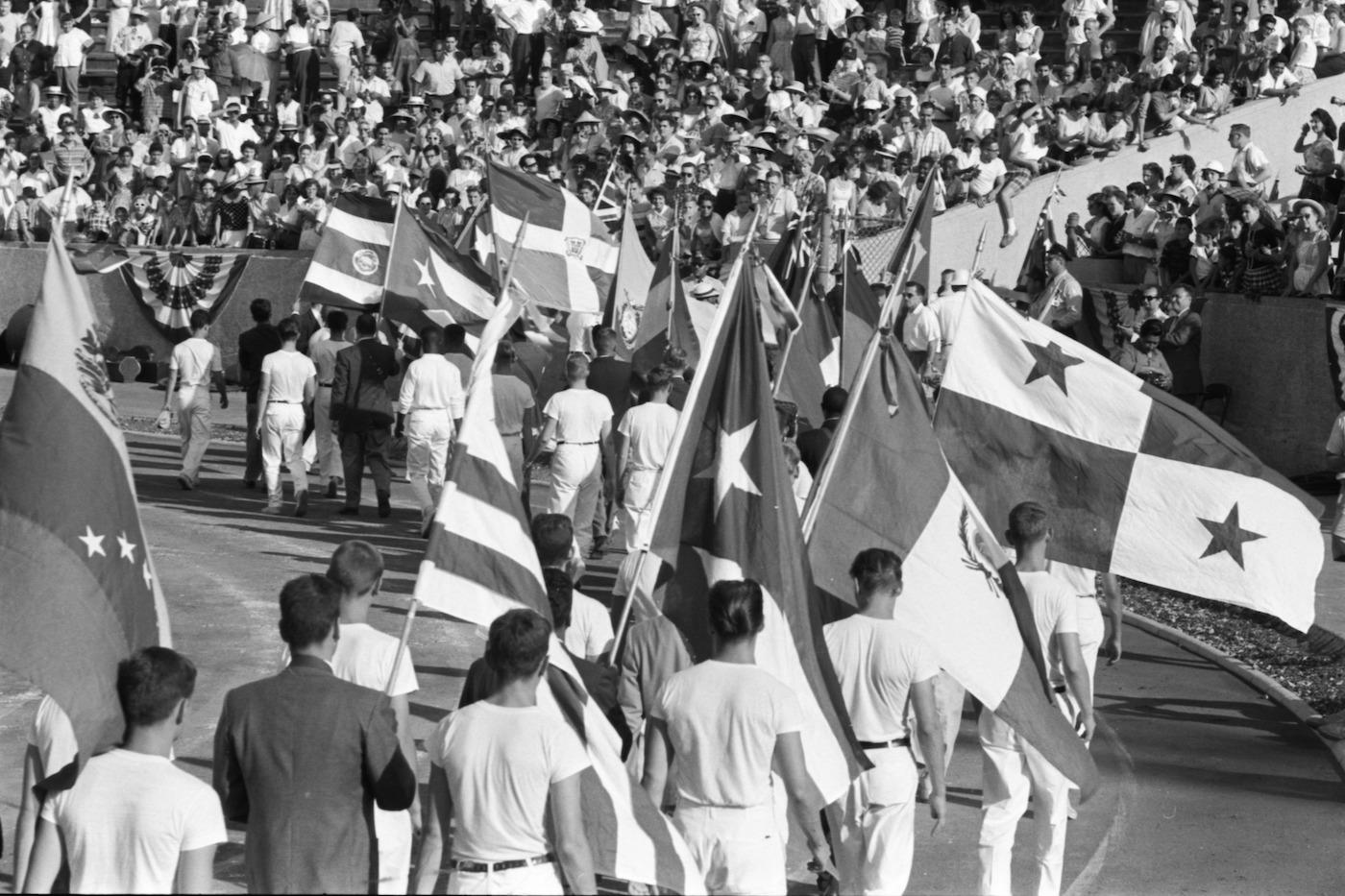 A parade of flags during the 1959 Pan-American Games in Chicago's Soldier Field. Photo: Chicago History Museum
