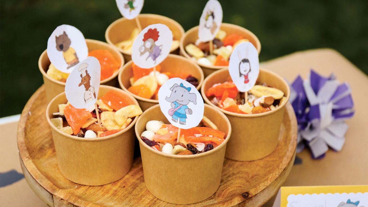 Cups of trail mix with pictures of cartoon characters