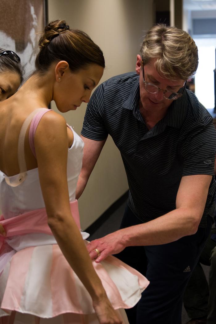 Artistic Director Ashley Wheater with Joffrey Ballet dancer Anais Bueno in costume fittings for the Nutcracker. Photo: Chloe Hamilton