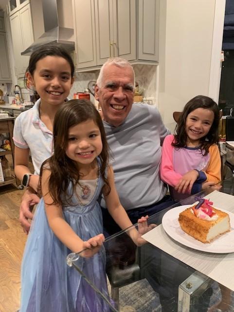 Carlos Lozano with his three granddaughters 