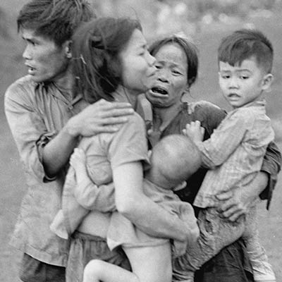 Civilians huddle together after an attack by South Vietnamese forces. Dong Xoai, June 1965. Photo: AP/Horst Faas