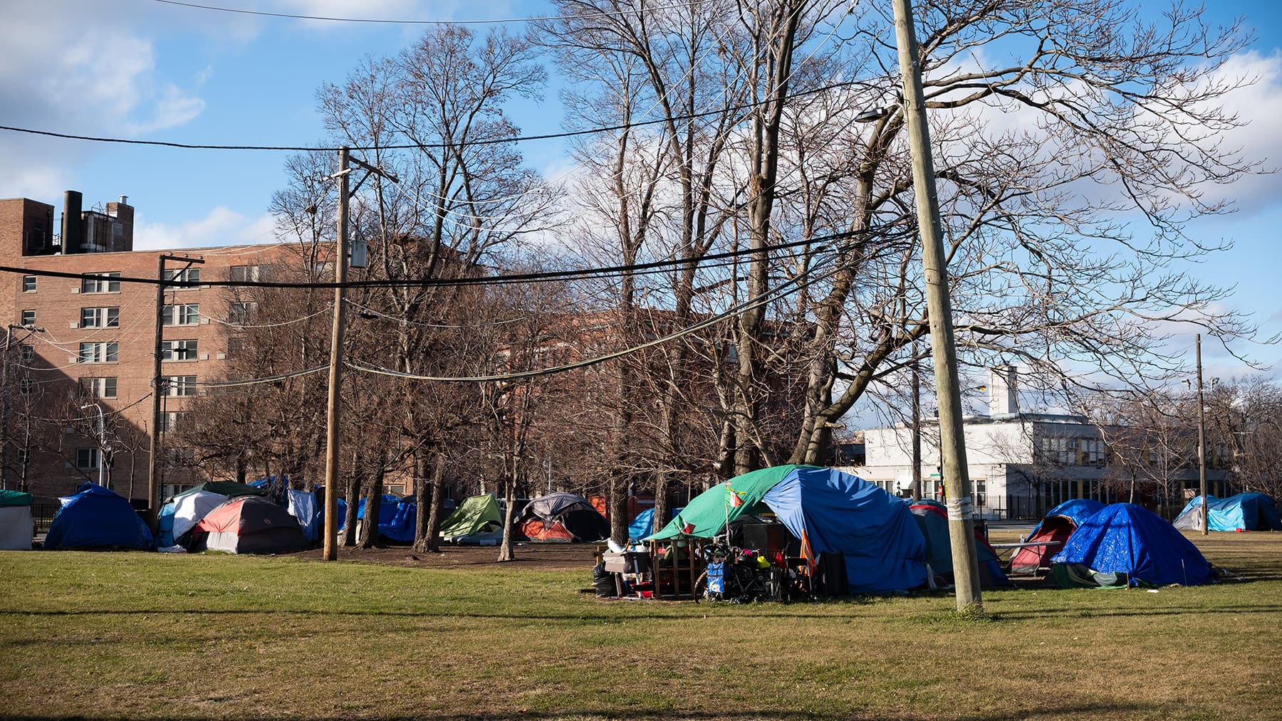 Encampment in open lot adjacent to the 12th District Chicago Police Department.