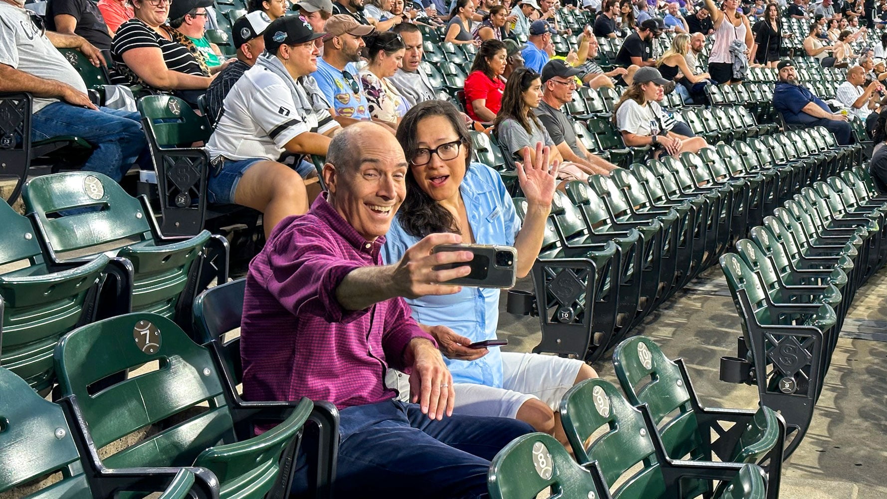 Geoffrey Baer and Monica Eng taking a selfie at Guaranteed Rate Field