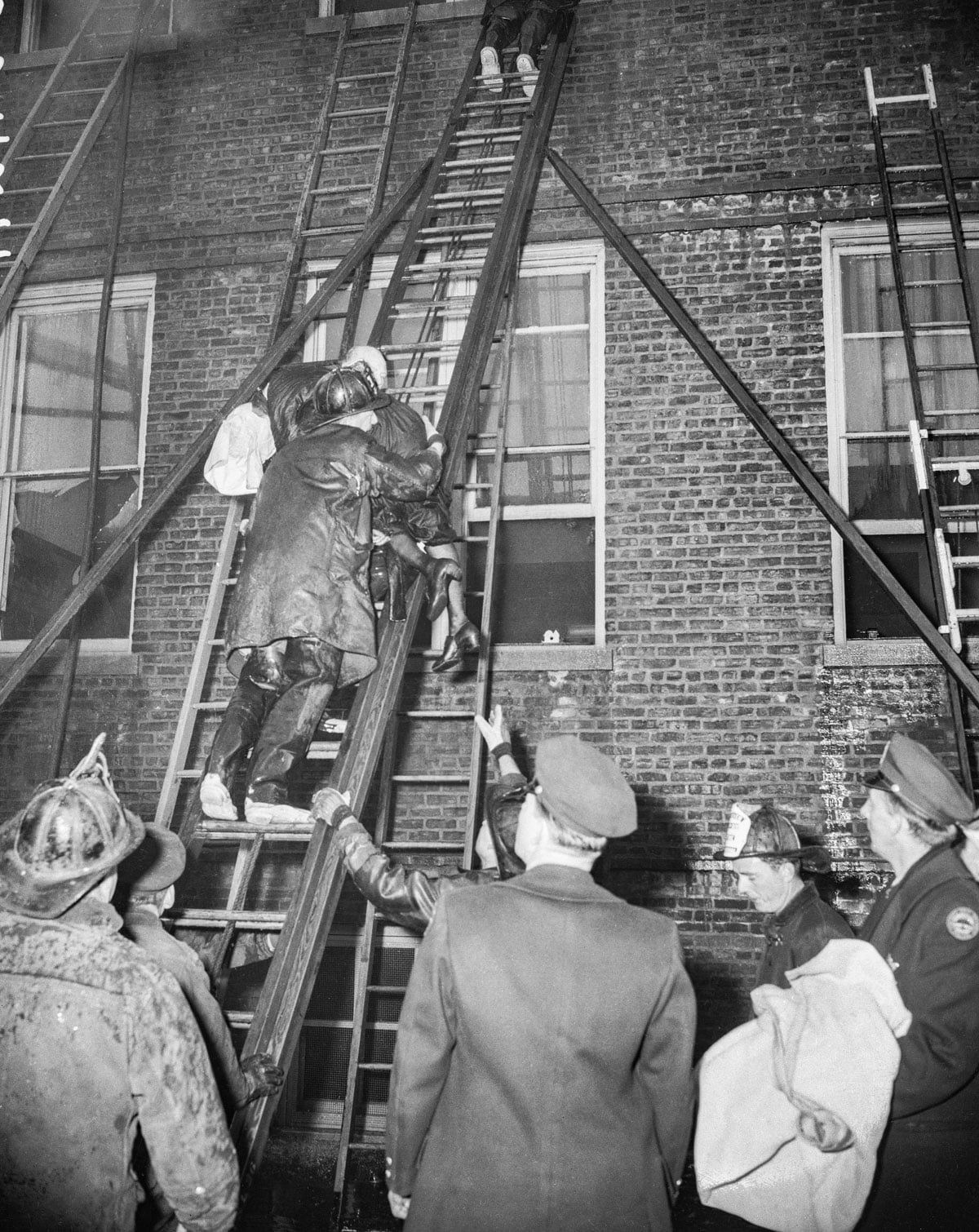 A firefighter rescues a nun from the building