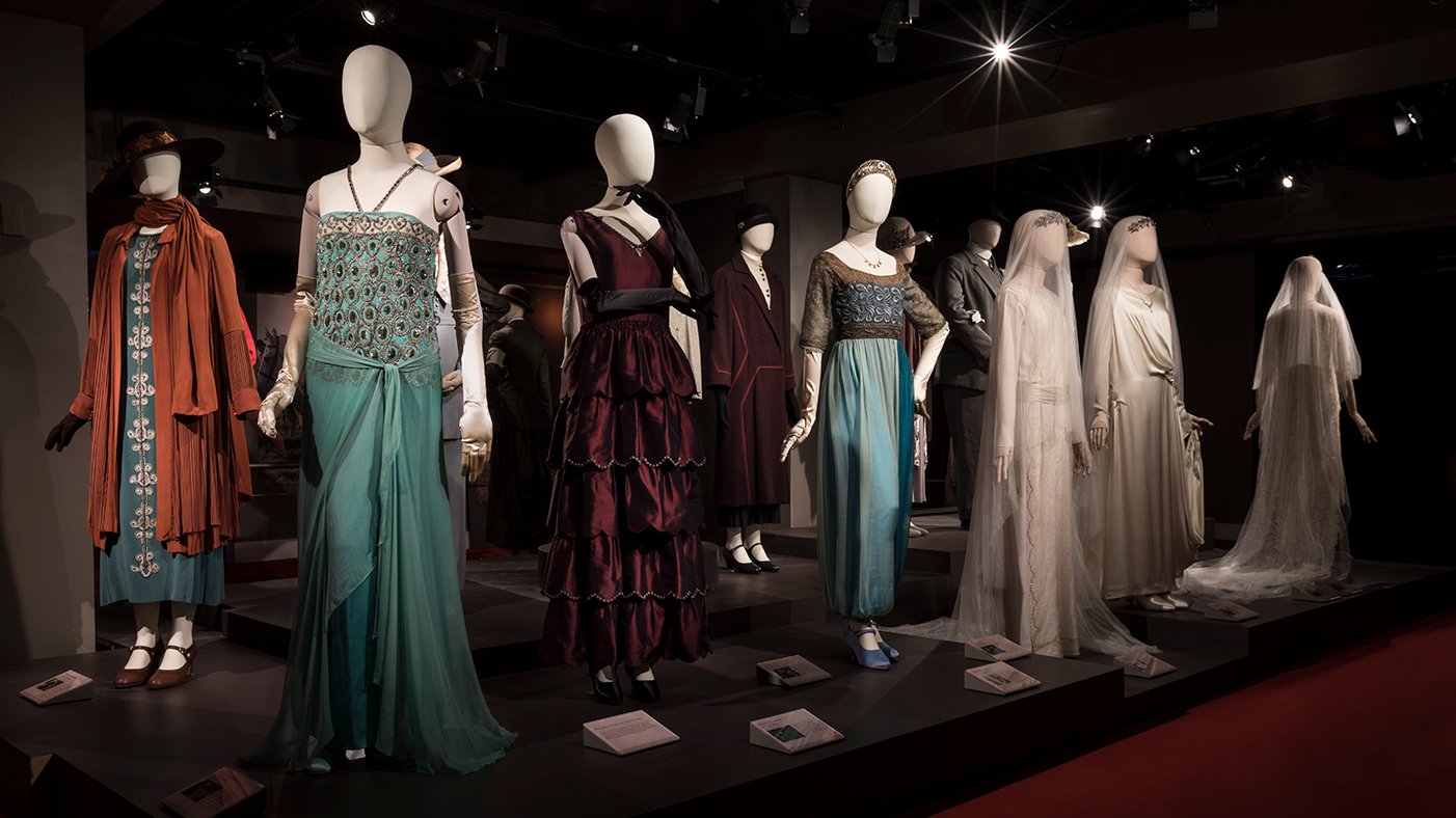 A display of costumes from Downton Abbey on mannequins