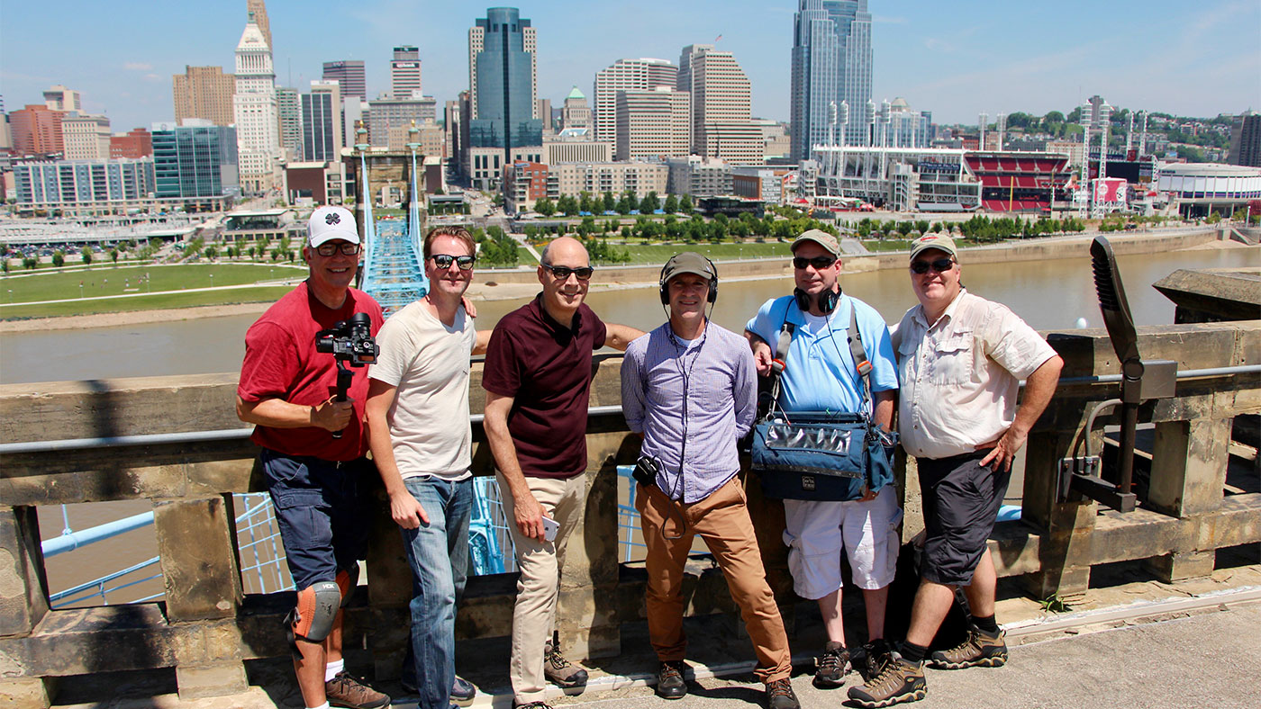 10 That Changed America crew poses on the Kentucky side of the Roebling Bridge on July 26, 2017