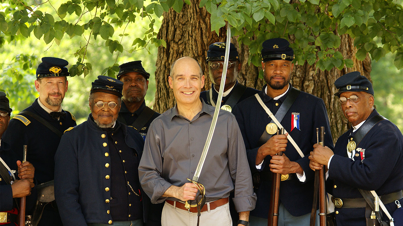 Geoffrey Baer poses with members of the 54th Massachusetts Volunteer Regiment, Company A, in Boston, Massachusetts