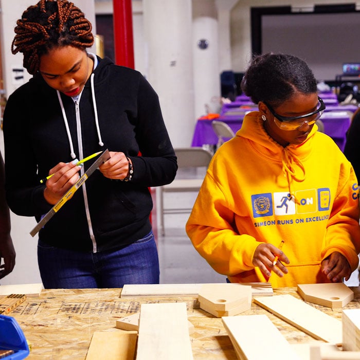 CPS students get hands-on training under the guidance of CWIT leaders in woodworking, welding, and wiring