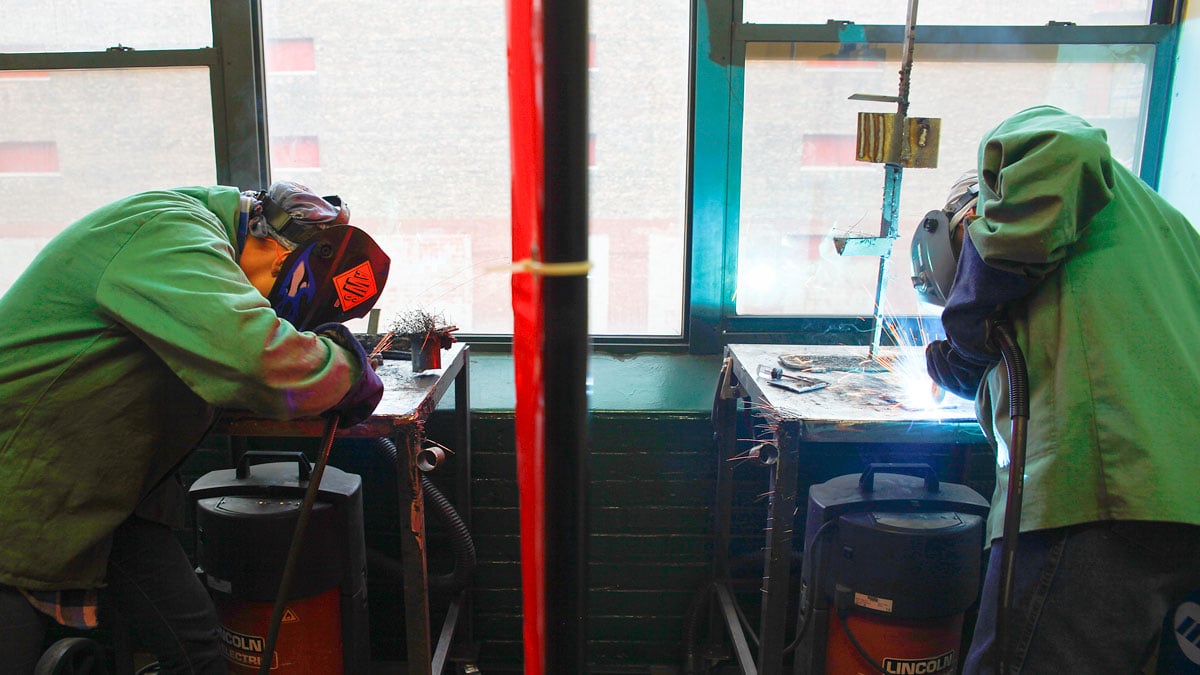 Two welding students practice side-by-side at CWIT headquarters