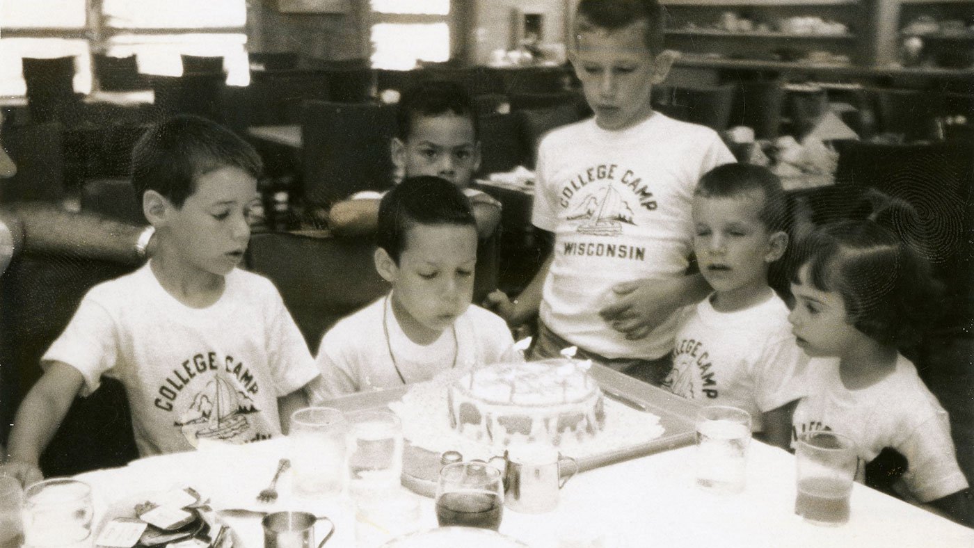 A young Geoffrey Baer celebrates his seventh birthday at 'College Camp' in Lake Geneva, Wisconsin