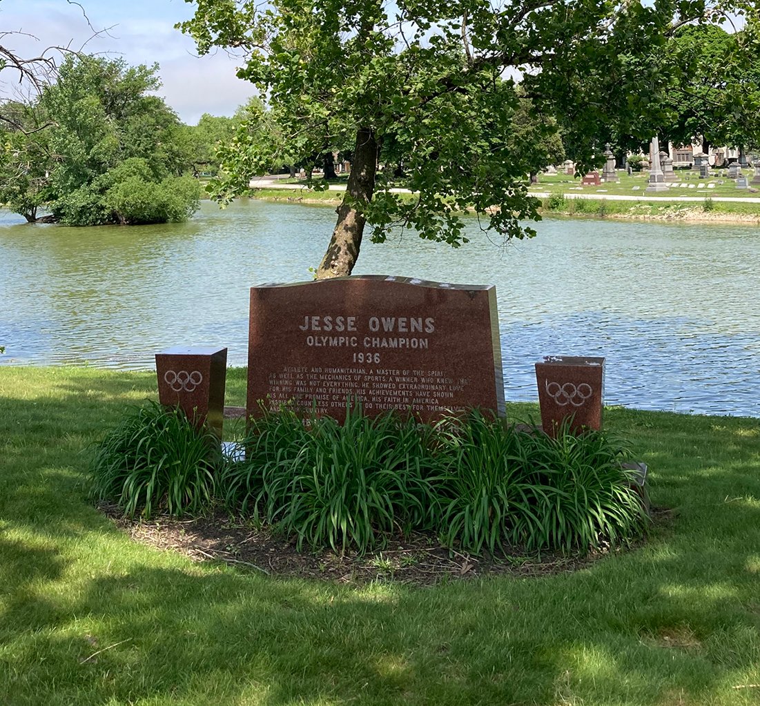 The grave of Jesse Owens, under a tree in front of a pond