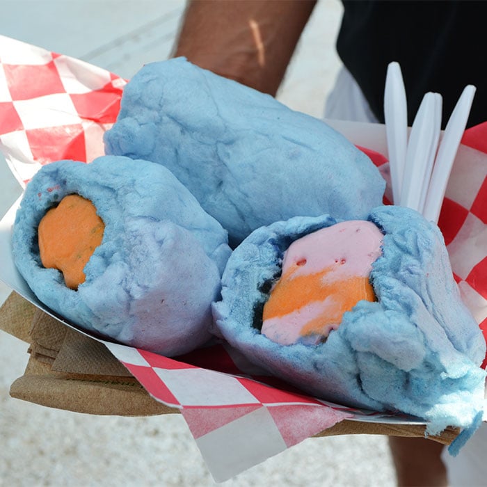 three scoops of ice cream rolled in cotton candy
