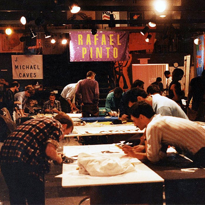 People sew panels for the AIDS Memorial Quilt at the NAMES Workshop