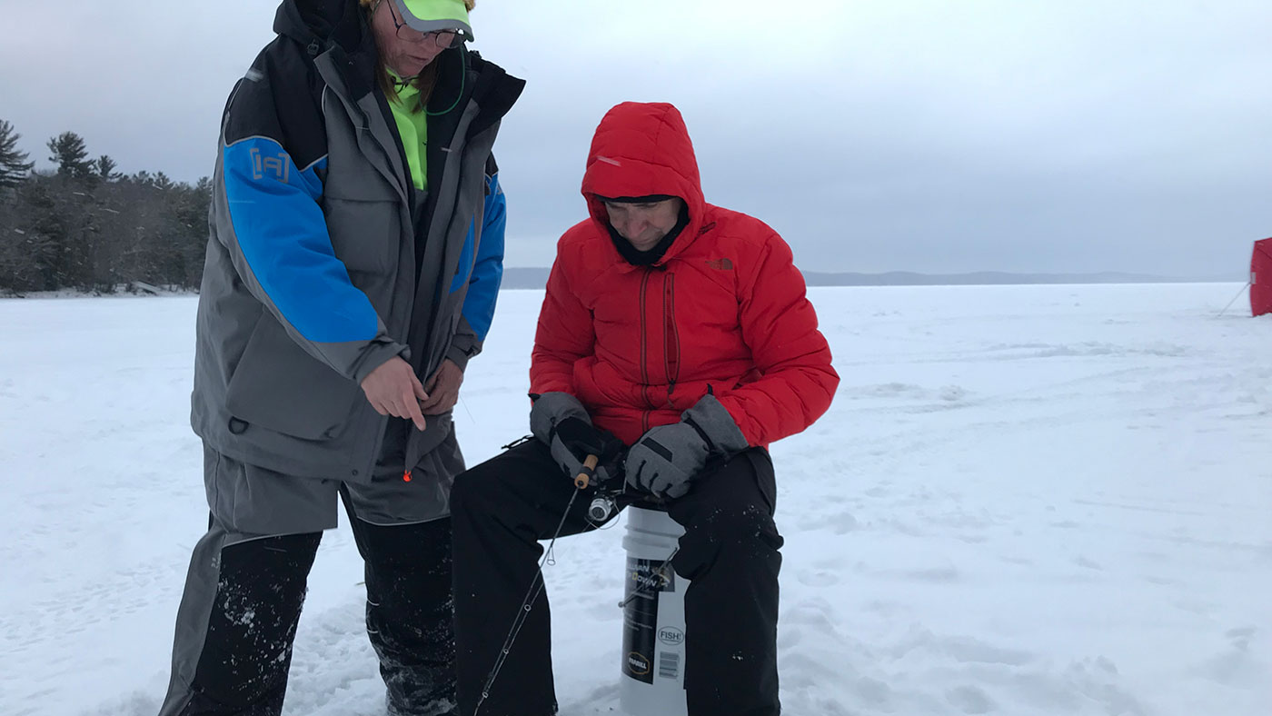Jan Michalets patiently gives Geoffrey Baer some beginner ice-fishing pointers 