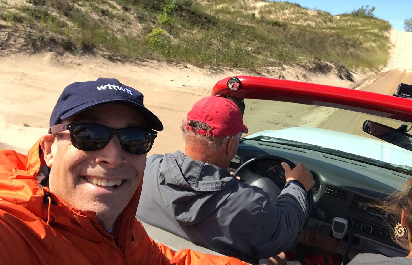Geoffrey Baer takes a selfie in a dune buggy in Silver Lake, Michigan