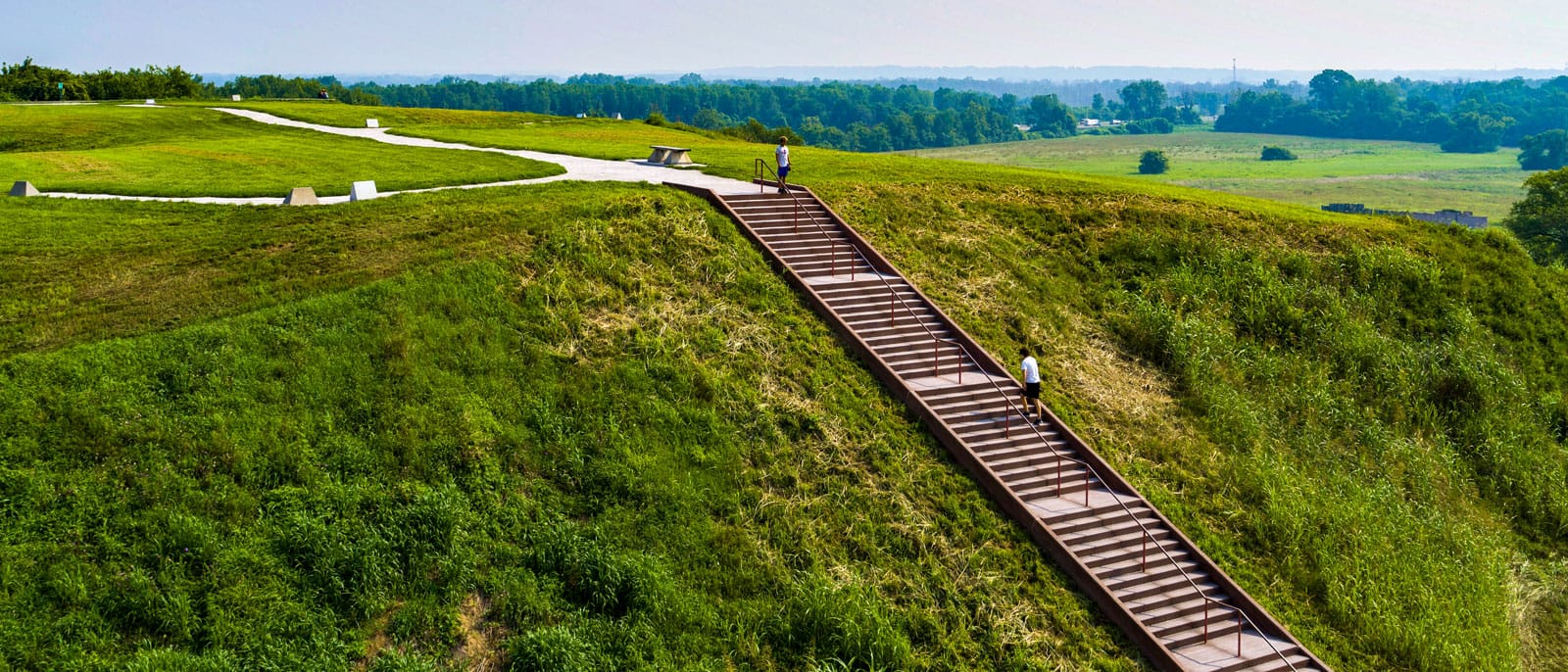 Monks Mound with people climbing stairs pictured from above