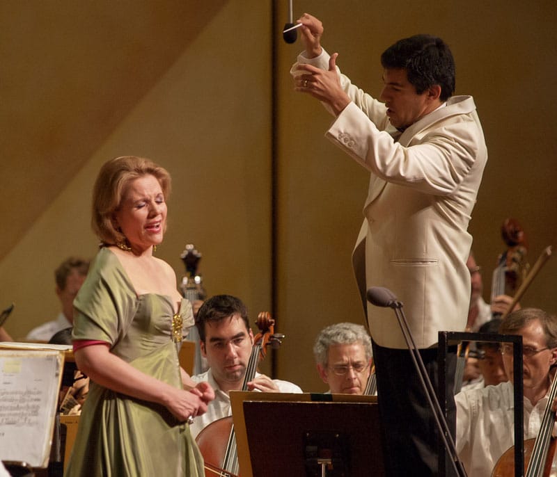 Renee Fleming singing with conductor conducting