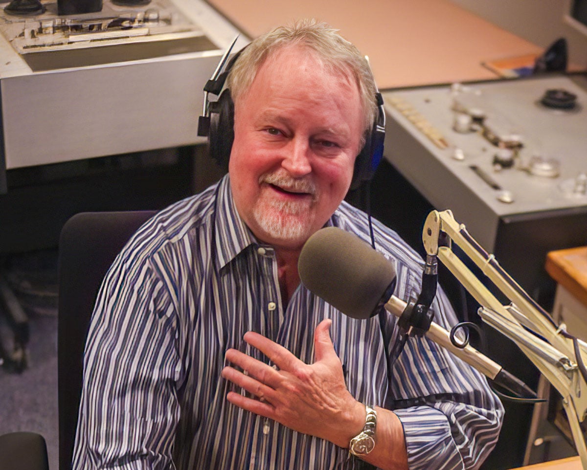 Bill McLaughlin in WFMT studio, smiling