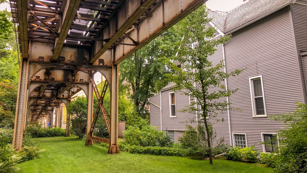 Train tracks running through the backyard of a home