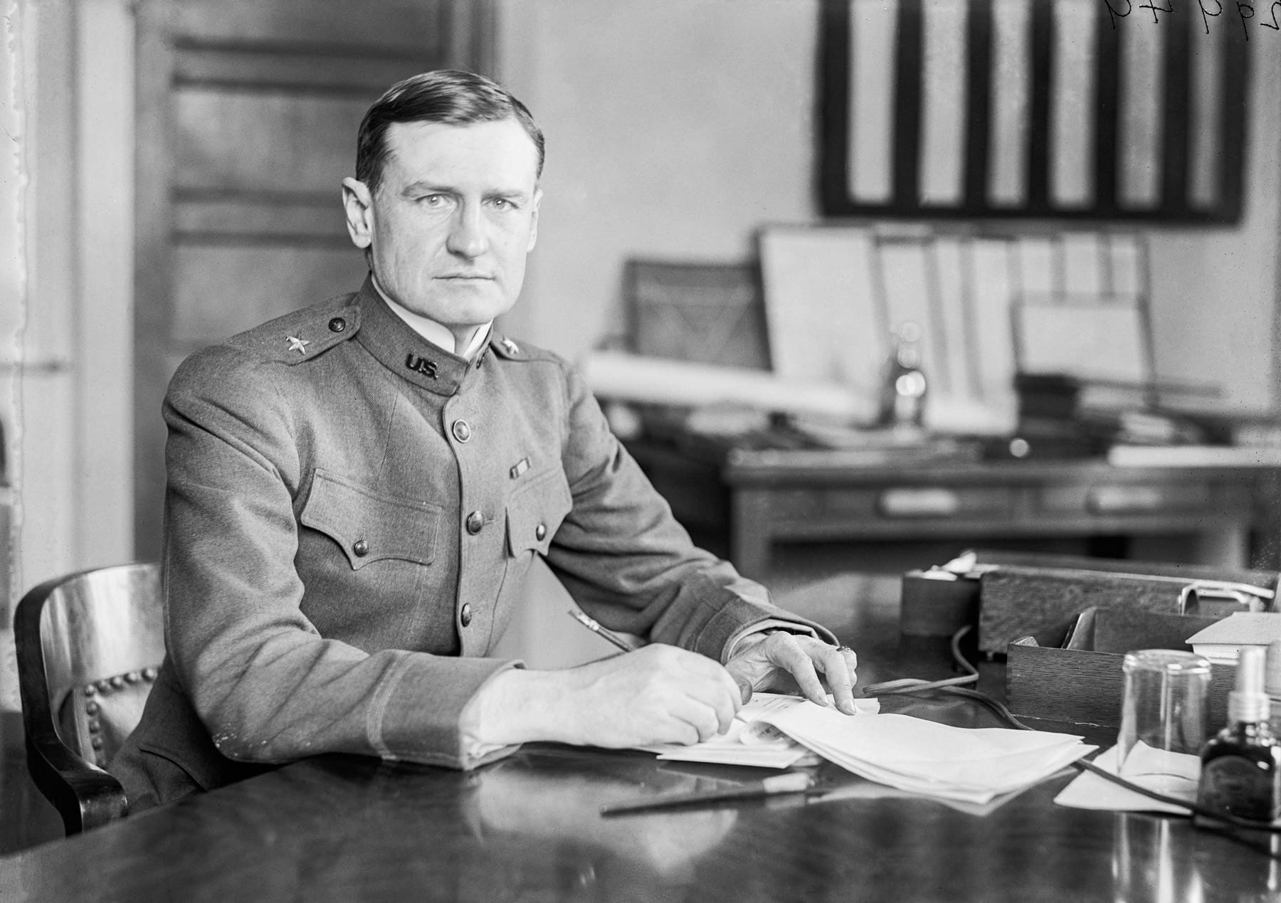 Robert E. Wood sitting behind his office desk