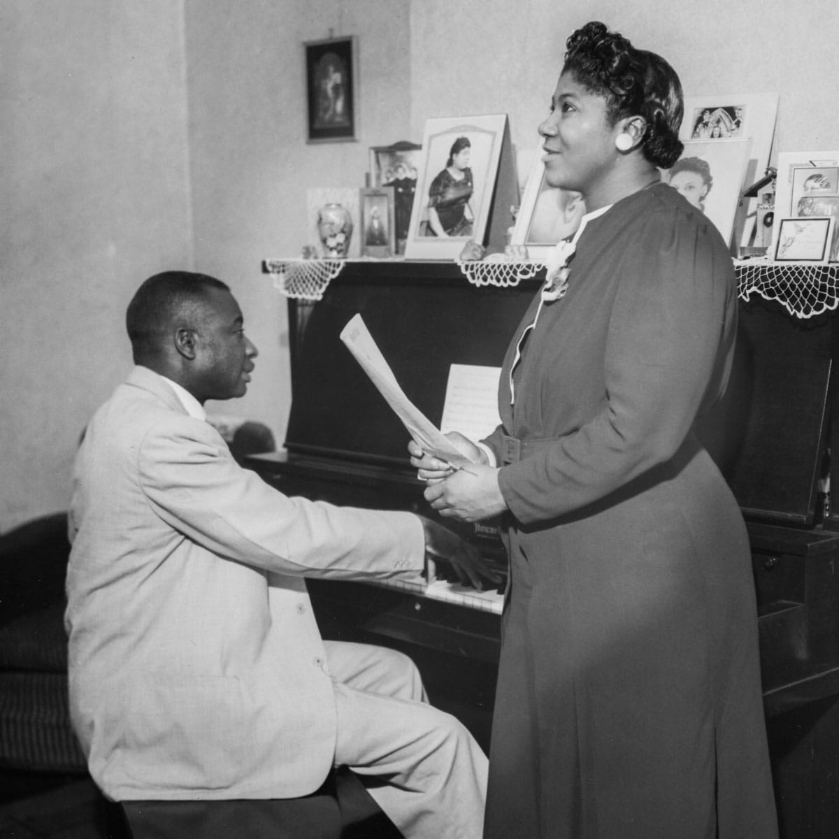 Thomas Dorsey at piano with Mahalia Jackson standing nearby