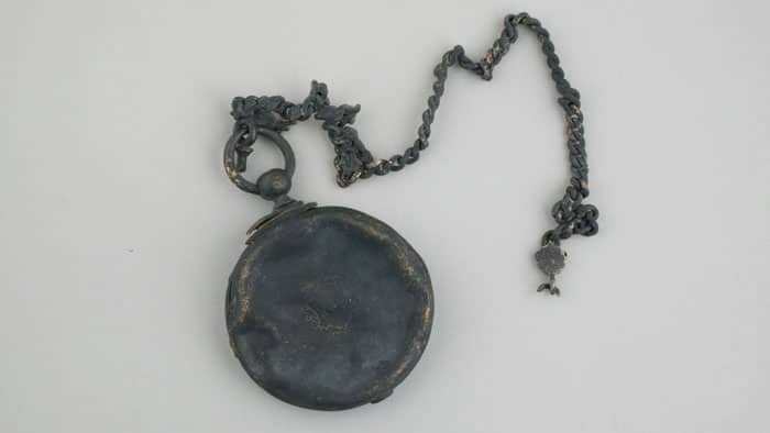 Charred and blackened pocketwatch from the Chicago Fire