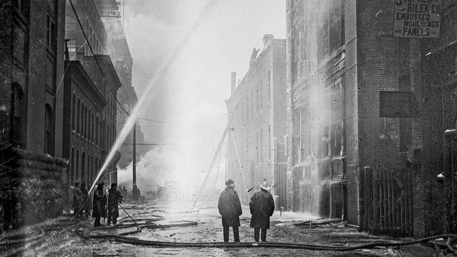 Firemen spray water at the Iroquois Theater Fire to extinguish the blaze