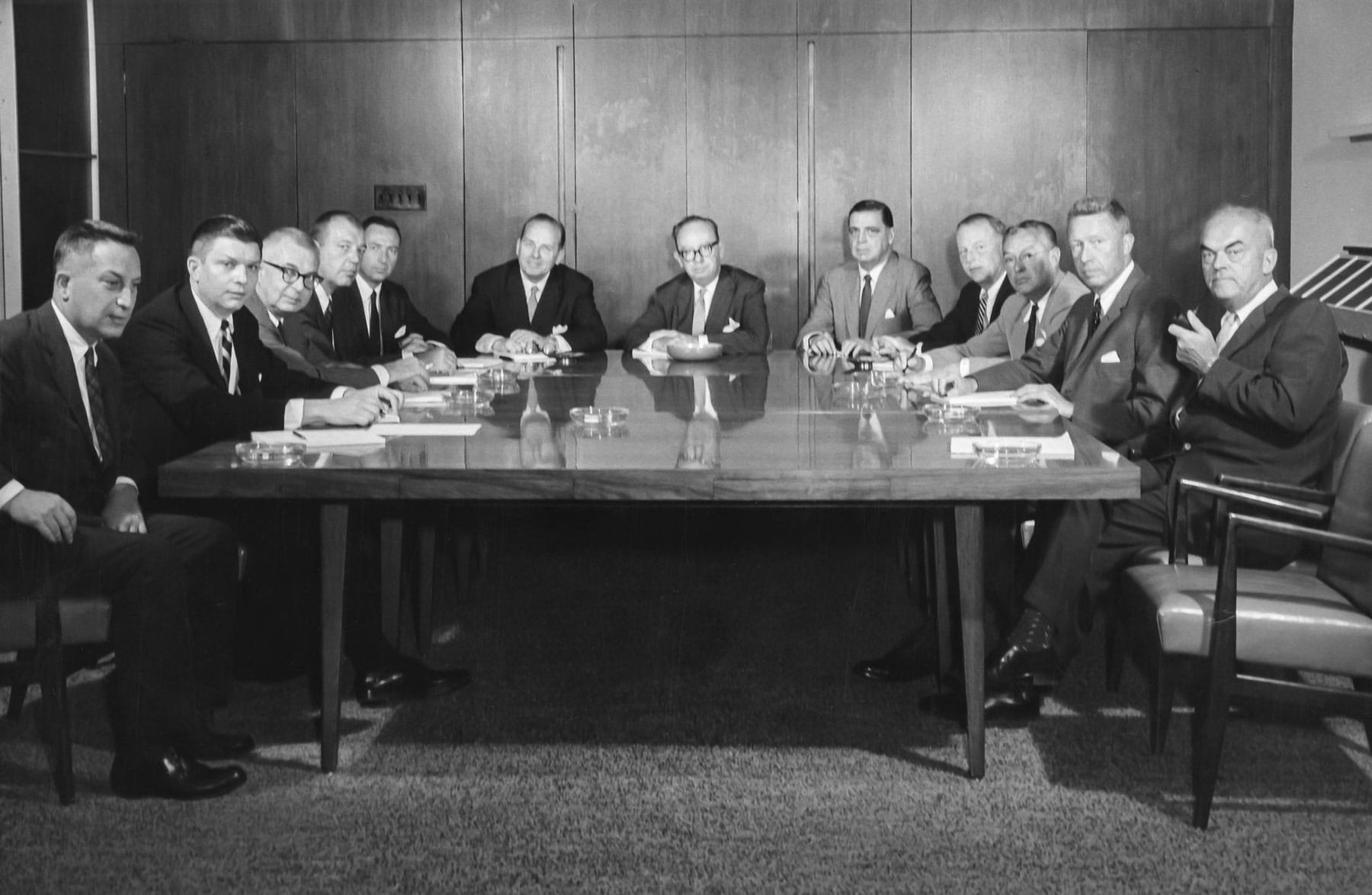 Loe Burnett and others at his agency sitting around conference table