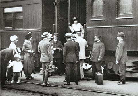 A porter assists passengers