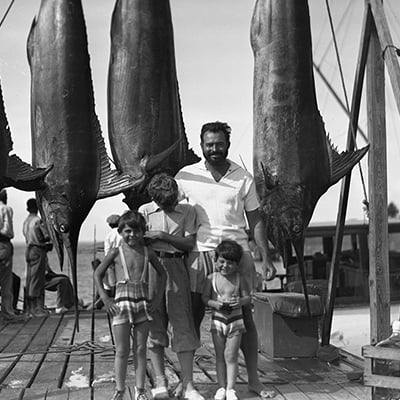 Ernest Hemingway and his three sons (L-R: Patrick, Jack, and Gregory) on the Bimini docks, July 20, 1935. Photo: Courtesy Ernest Hemingway Photograph Collection. John F. Kennedy Presidential Library and Museum, Boston