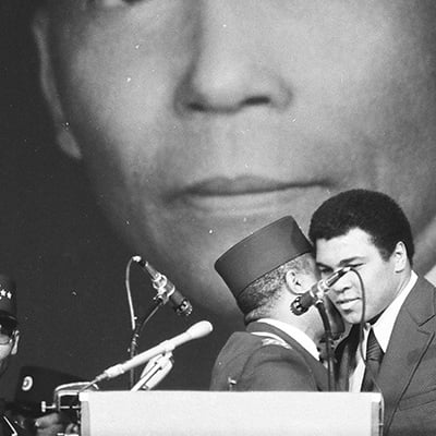 Wallace D. Muhammad and Muhammad Ali at funeral rites for Elijah Muhammad held at the International Amphitheatre, 4220 South Halsted Street, Chicago, Illinois on February 20, 1975. Photo: ST-19110566-0001, Chicago Sun-Times collection, Chicago History Museum