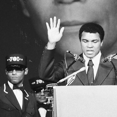 Muhammad Ali speaks at funeral rites for Elijah Muhammad held at the International Amphitheatre, 4220 South Halsted Street, Chicago, Illinois on February 20, 1975. Photo: ST-19110566-0011, Chicago Sun-Times collection, Chicago History Museum