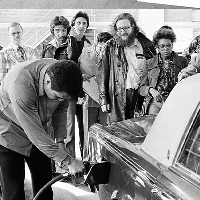 People stand around as Muhammad Ali pumps gas into his Rolls Royce in Chicago, Illinois on March 31, 1978. Photo: ST-19080061-0002, Chicago Sun-Times collection, Chicago History Museum