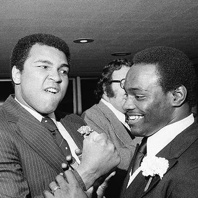 Muhammad Ali and Walter Payton at an awards dinner in Chicago, Illinois on April 7, 1979. Photo: ST-19130553-0003, Chicago Sun-Times collection, Chicago History Museum