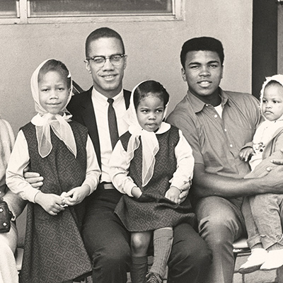 Malcolm X and family pose for a photo with Cassius Clay on a trip to Miami. Miami, Florida. January 1964. Photo: Courtesy of Robert Haggins