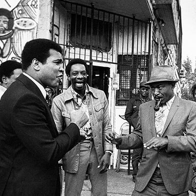 Muhammad Ali enjoying a spontaneous encounter with his fans in Detroit, MI. Circa 1977. Photo: Courtesy of Michael Gaffney